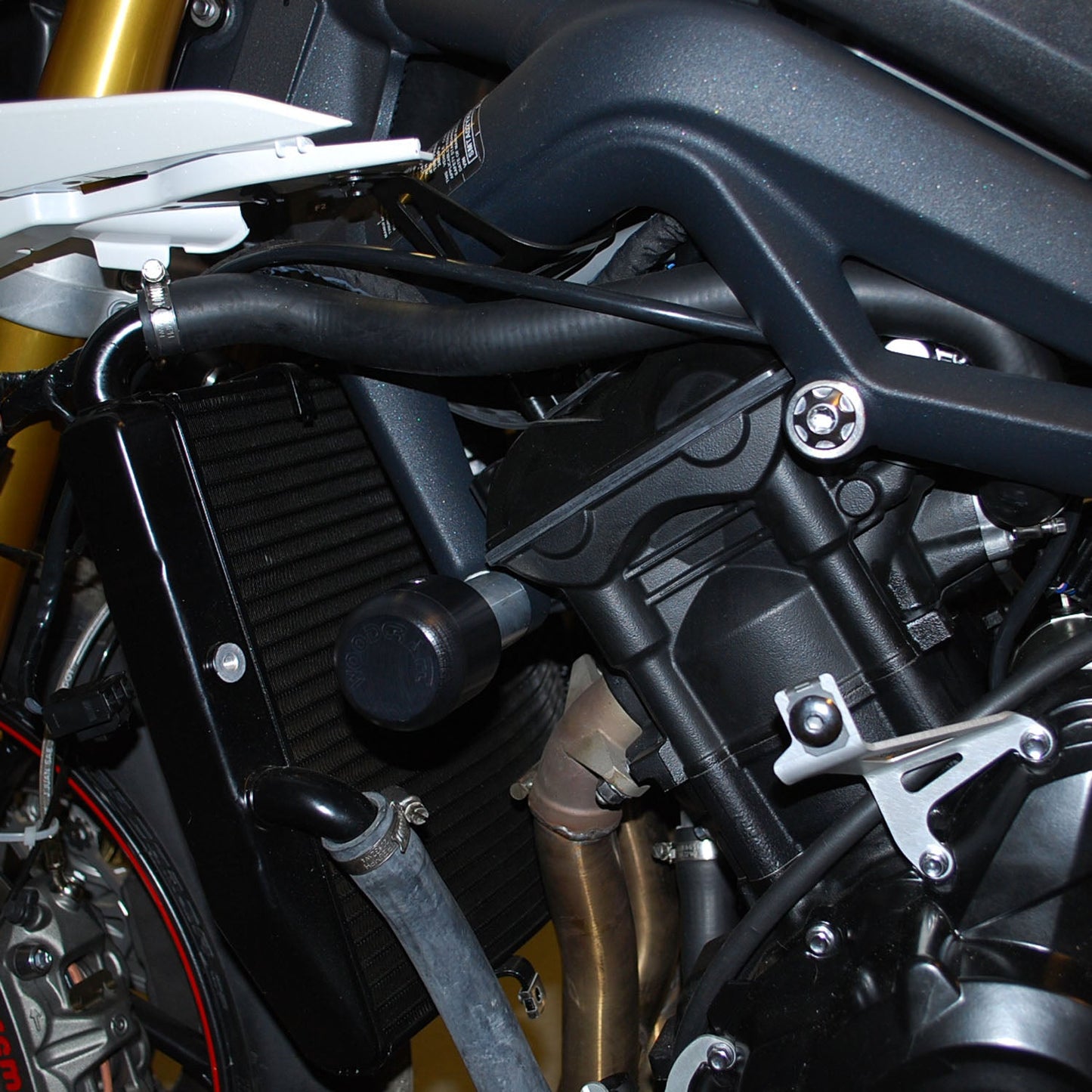 50-0502U Triumph 675 2013-17 / Street Triple 2013-16 Under Body Frame Slider Kit Assembly (1099 Pucks Included) - Woodcraft Technologies